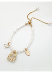 Elegant Pearl Charm Bracelet with Gold Handbag Pendant