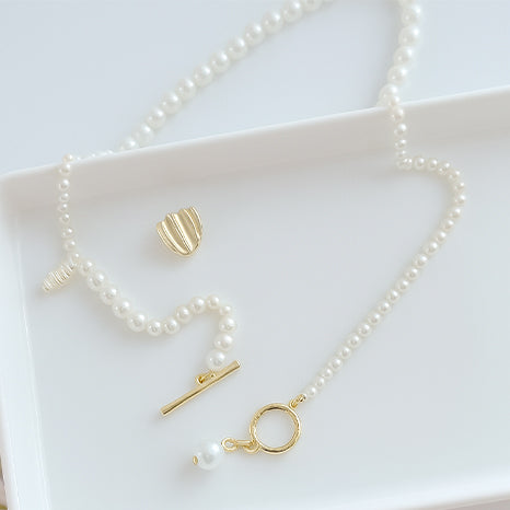 Elegant Pearl Chain with Gold Toggle Design
