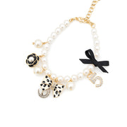 Elegant Pearl Charm Bracelet with Bow Details