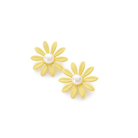 yellow flower with a pearl in the middle
