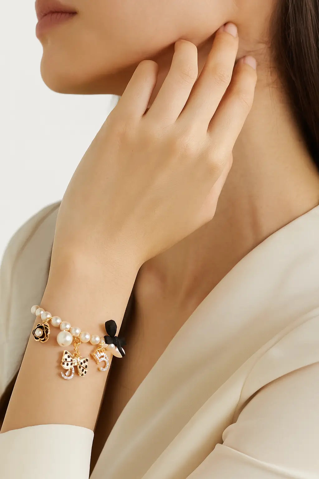 Elegant Pearl Charm Bracelet with Bow Details